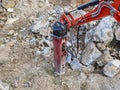 Excavator with hydraulic hammer on road construction works Royalty Free Stock Photo