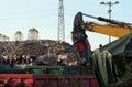 Excavator hydraulic magnetic boom at work in the recycli