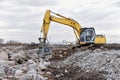 Excavator with jaw crusher bucket for crushes concrete and recycle material. MB Crusher screening bucket for diggers capable of