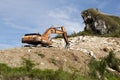 Excavator at a limestone quarry in Indonesia