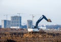 Excavator load the sand to the dump truck on construction site.