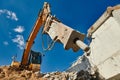 Excavator loader machine at demolition with hydrohammer on construction site Royalty Free Stock Photo