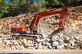 An excavator loader machine during earthmoving works at construction site at Evia, Greece