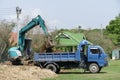 Excavator is loading dirt on truck Royalty Free Stock Photo