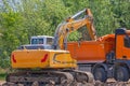 Excavator Loading Dirt Truck Royalty Free Stock Photo
