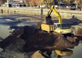 Excavator loading dumper truck