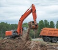 Excavator Loading Dumper Truck Royalty Free Stock Photo