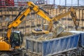 Heavy construction equipment working at the construction site