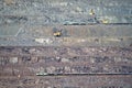 Excavator loading iron ore into goods wagon on the iron ore opencast mine Royalty Free Stock Photo