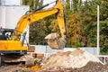 Excavator Loading Soil into Dump Truck Royalty Free Stock Photo