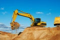 Excavator loading tipper dumper Royalty Free Stock Photo