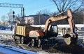 excavator loads crushed stone in a dump truck body. Construction of the railway. Preparing the surface of the earth for laying Royalty Free Stock Photo