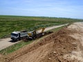 Excavator and truck