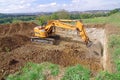 Excavator machine loading and unloading earth Royalty Free Stock Photo