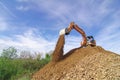 Excavator machine loading and unloading earth Royalty Free Stock Photo