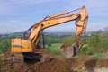 Excavator machine loading and unloading earth Royalty Free Stock Photo