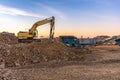 Excavator and machine to pulverize stone in a quarry