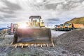 Excavator moving stone and rock at a construction site