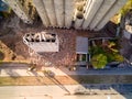 Excavator near abandoned concrete elevator building in Kharkiv, Ukraine