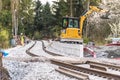 The excavator near railway tracks Royalty Free Stock Photo