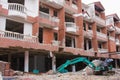 Excavator near a ruined building Royalty Free Stock Photo