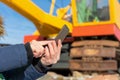 Excavator operator checks the data on smartphone
