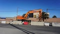 Excavator parked on the road side during the roadworks in El Medano, Tenerife Royalty Free Stock Photo