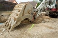 Excavator ploughshare on trench - constructing canalization