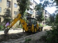 Excavator . road repair of the road in the garden worker escavator Royalty Free Stock Photo