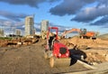 Excavator and road roller at road construction. Asphalt paver machine and heavy machinery for road work. Building a road works.