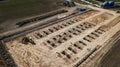 Excavator running on the construction site aerial view from the drone Royalty Free Stock Photo