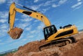 Excavator in sandpit