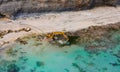 Excavator in the sea. Geology exploitation. Royalty Free Stock Photo