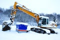 Excavator in snow