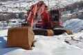 Excavator on snow