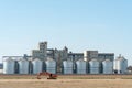 silver silos on agro manufacturing plant for processing drying cleaning and storage of agricultural products, flour, cereals and