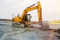 Excavator at street construction site on the countryside