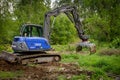 With an excavator of the technical relief organization the rubble of a building site is loaded