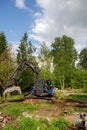 With an excavator of the technical relief organization the rubble of a building site is loaded