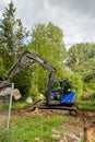 With an excavator of the technical relief organization the rubble of a building site is loaded