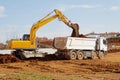 Excavator and tipper truck Royalty Free Stock Photo