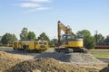 Excavator and track tamping machine on a construction site Royalty Free Stock Photo