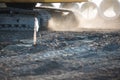 Excavator tracks putting up a dust cloud