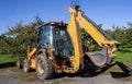 Excavator Tractor in an Apple Orchard Royalty Free Stock Photo