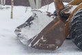 Excavator tractor bucket with snow in winter Royalty Free Stock Photo