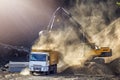 Excavator and truck for construction site. Excavation is the process of moving earth, rock or other materials with tools. Royalty Free Stock Photo
