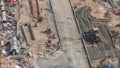 Excavator, truck and grader working at road construction site in Dubai downtown timelapse