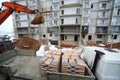 Excavator unload cement from a truck to the construction