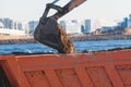 Excavator unloading sand into the dump truck on the construction site, excavating and working during road works, backhoe and Royalty Free Stock Photo