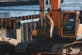 Excavator unloading sand into the dump truck on the construction site, excavating and working during road works, backhoe and Royalty Free Stock Photo